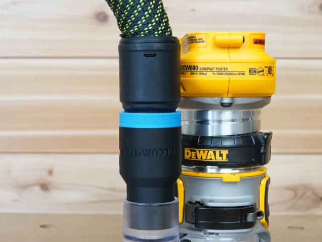 Blue hose adapter with blue band attached to DeWalt DCW600 compact router, stacked with other router collets