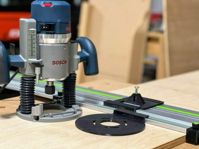 Bosch 1617 plunge router mounted on FS rail with black LR32 drilling plate and spring-loaded depth stop positioned for hole drilling