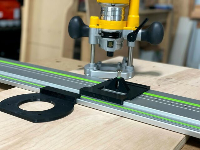 Dewalt trim plunge router mounted on Festool rail with ToolCurve LR 32 plate and black drilling jig attached to rail, showing circular base plate and guide stops