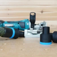 Black 36mm hose adapter with blue collar shown twice beside a Makita cordless plate joiner, one end on a hose