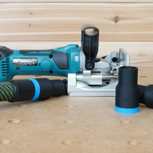 Black and blue ToolCurve hose adapters beside a Makita XJP03 cordless plate joiner, one joined to a hose
