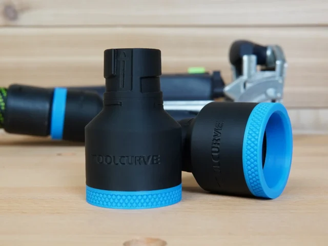Black ToolCurve hose adapter with blue grip bands, shown front and side view with Festool hoses connected in background