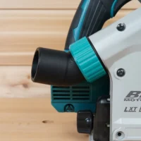 ToolCurve No Snag Dust Port attached to a Makita track saw, with black hose routed upward through the turquoise adapter