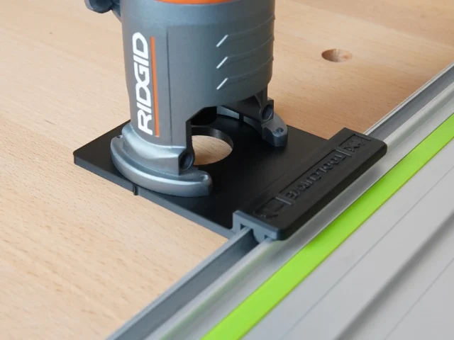 Ridgid trim router mounted on a black ToolCurve adapter attached to a Kreg guide rail