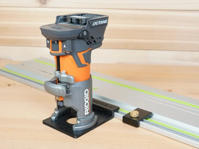 Ridgid trim router mounted on FS rail adapter, positioned over a Festool-style guide rail on wood