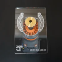 Extended base plate for Ridgid trim router shown from above in clear acrylic packaging, with brass center collar, white mounting arms, and orange router body visible below