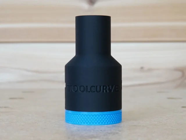 Black hose adapter with blue grip band and ToolCurve branding, front view