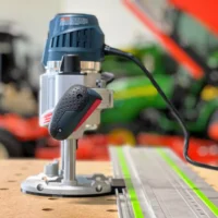 Bosch MR23EVS plunge router mounted on FS rail with ToolCurve LR32 adapter and spring-loaded positioning knob