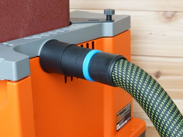Black 36mm hose adapter with blue band joining a braided extractor hose to the orange Ridgid edge sander's dust port