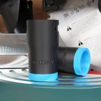 ToolCurve hose adapter for Bosch 10" glide miter saw, with black cylindrical body, bright blue textured grip bands, and ToolCurve branding embossed on the barrel.