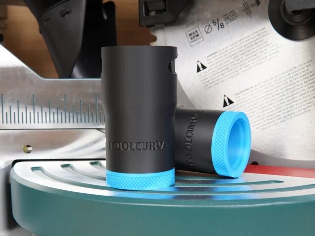 ToolCurve hose adapter for Bosch 10" glide miter saw, with black cylindrical body, bright blue textured grip bands, and ToolCurve branding embossed on the barrel.