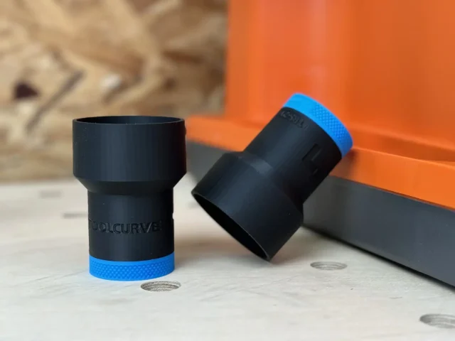 Black ToolCurve hose adapter with blue grip band, shown upright and angled, for Ridgid oscillating edge sander rear dust port