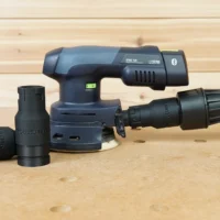 Dewalt Quick Connect hose adapter attached to an orbital sander, with three black adapter ports displayed separately