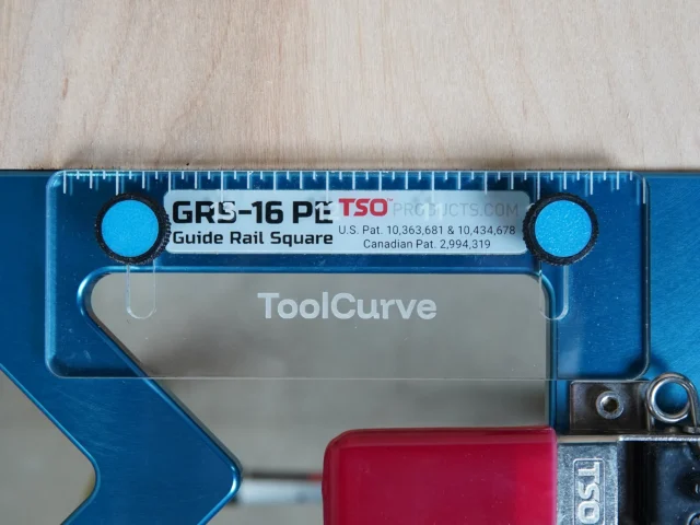 TSO Guide Rail Square anti-tip support tab in blue with bright cyan mounting knobs, labeled GRS-16 PE, shown from top view on wooden surface