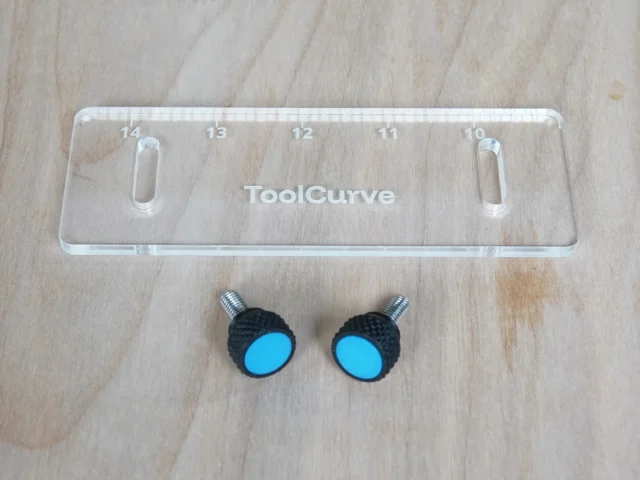 Clear acrylic guide rail square support tab with numbered scale 10-14, two black knobs with blue centers and threaded metal studs for mounting