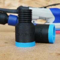 Black ToolCurve hose adapter with threaded port and blue grip ring, displayed with SurfPrep sanders in background