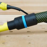 Black 36mm hose adapter with blue ring joining a braided extractor hose to a yellow Ryobi sander dust port