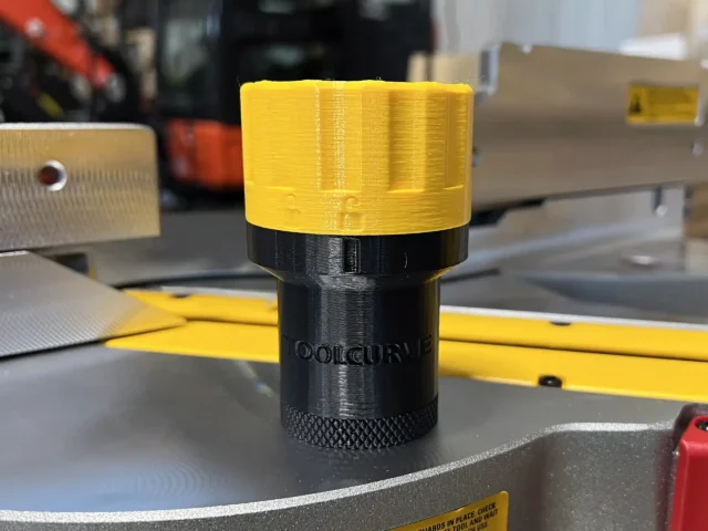 Yellow and black hose adapter with knurled grip base, labeled for Dewalt Quick Connect ports, displayed standing upright on a workshop surface