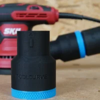 Black ToolCurve 36mm hose adapter with blue knurled collar standing in front of a red SKIL sander and hose