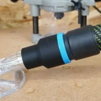 Black 36mm hose adapter with blue ring joining an extractor hose to a clear Oneida router hood port
