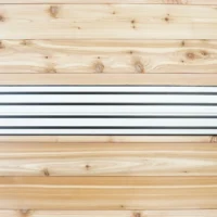 Dewalt track saw rails mounted on wooden wall with yellow mounting brackets at ends and black end caps