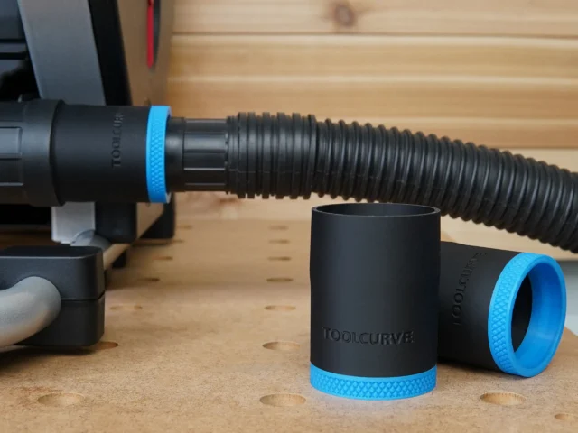 Black ToolCurve hose adapter with blue grip bands, shown alone and attached to SawStop CTS dust hose on wooden workbench