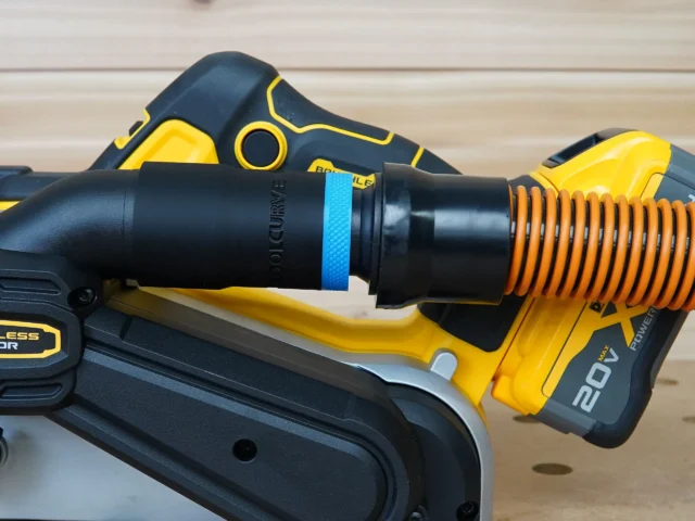 Use your standard shop vac 1-1/4" hose with your Dewalt 20v Max Belt Sander