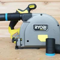 Black ToolCurve hose adapter with blue band attached to Ryobi One+ HP cordless track saw dust port, with matching adapter sleeves displayed in front