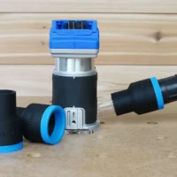 Black 1-7/8 inch hose adapter with blue collar joining a vacuum hose to a Kobalt 24v router, plus a spare adapter