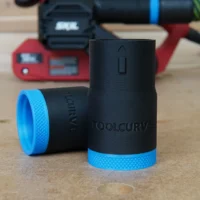 Black hose adapter with blue grip bands shown disassembled, labeled ToolCurve, for SKIL Belt Sander