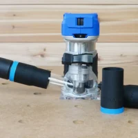 Black and blue hose adapter with 27mm connection displayed next to Kobalt 24v router with hose attached