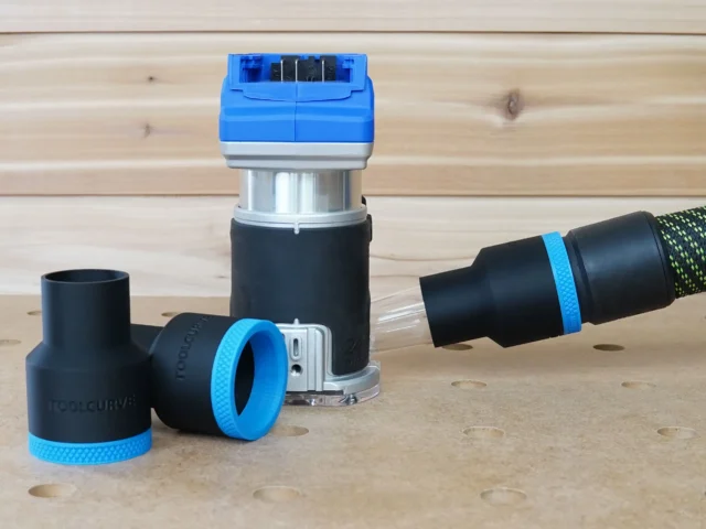 Black 36mm hose adapter with blue collar beside a Kobalt 24v router, second adapter joining a hose