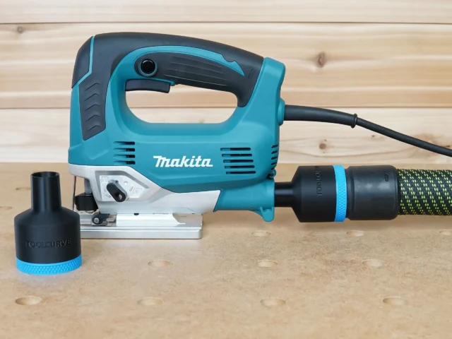 Black 36mm ToolCurve hose adapter with blue band shown loose and connected to a Makita jig saw dust port