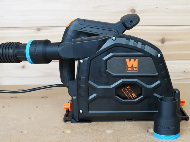 Black ToolCurve 1-7/8 inch hose adapter with blue band joining a vacuum hose to a Wen track saw dust port, second adapter beside it