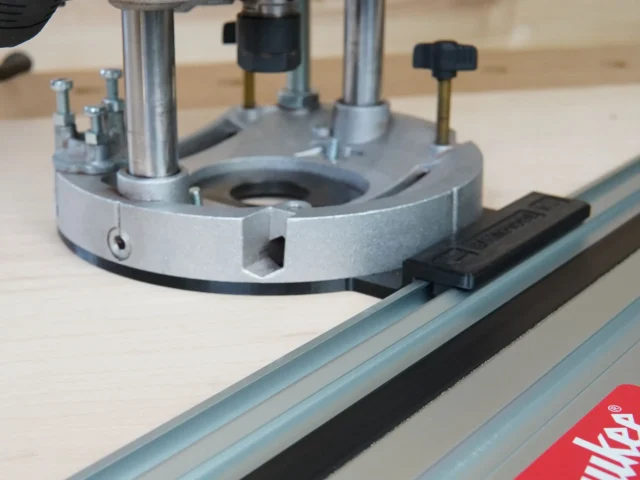 Guide rail adapter mounted on Dewalt DWE625 plunge router, attached to a Festool track saw rail