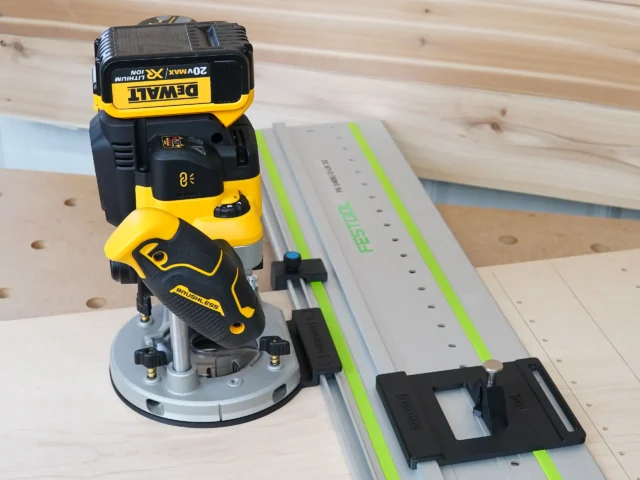DeWalt 20V router mounted on LR 32 plunge base attached to Festool guide rail with positioning knob and rail stops
