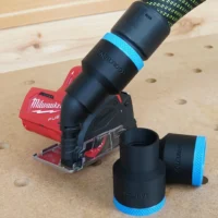 Black 36mm ToolCurve hose adapter with blue band joining a hose to a Milwaukee 12v cut out tool, spare alongside