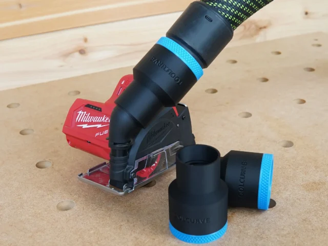 Black 36mm ToolCurve hose adapter with blue band joining a hose to a Milwaukee 12v cut out tool, spare alongside