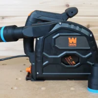 Black ToolCurve 36mm hose adapter with blue band on a Wen track saw dust port, second adapter attached to hose