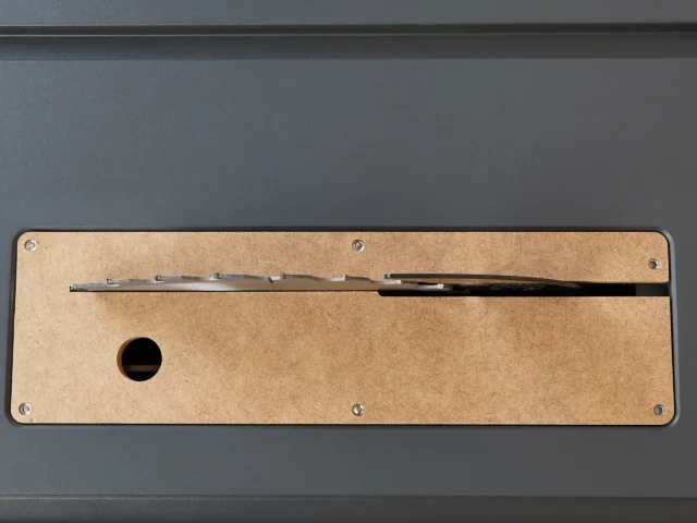 MDF zero clearance insert for SawStop Compact table saw, showing top view with blade slot and mounting holes
