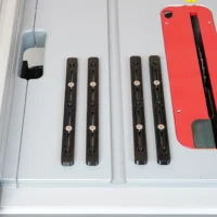 Four black adjustable miter bars with countersink holes and metal pivot points, displayed on a white surface next to a red plastic accessory
