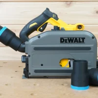 Black 1-7/8 inch hose adapter with blue cuff joining a vacuum hose to a DeWalt track saw, two spares nearby