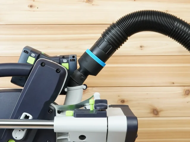 Black hose adapter with blue band joining a 2-1/2 inch ribbed hose to the 27mm dust port on a Festool tool