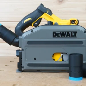 Black ToolCurve hose adapter with blue band joining a vacuum hose to a DeWalt track saw, two spare adapters beside it