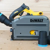 Black 36mm ToolCurve hose adapter with blue cuff joining a hose to a DeWalt track saw, spare adapters beside
