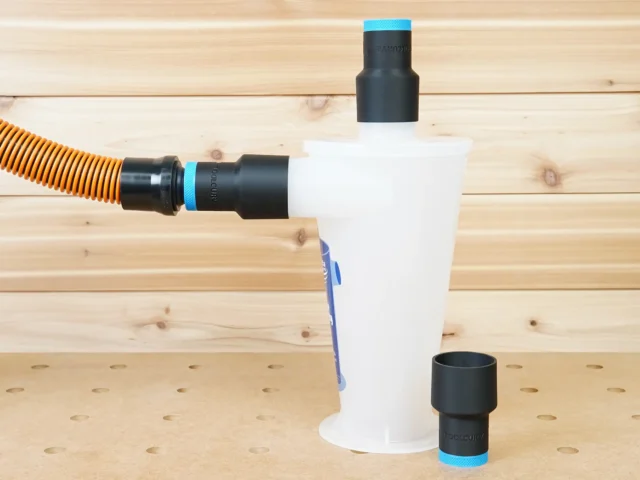 Black 1-1/4" hose adapters with blue bands fitted to an Oneida Dust Deputy cyclone, one linked to an orange hose