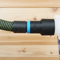 Black hose adapter with blue band attached to braided green and black Festool hose, labeled Oneida
