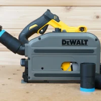 Black 1-1/4" hose adapter with blue collar joining an orange hose to a DeWalt track saw, two spares beside it