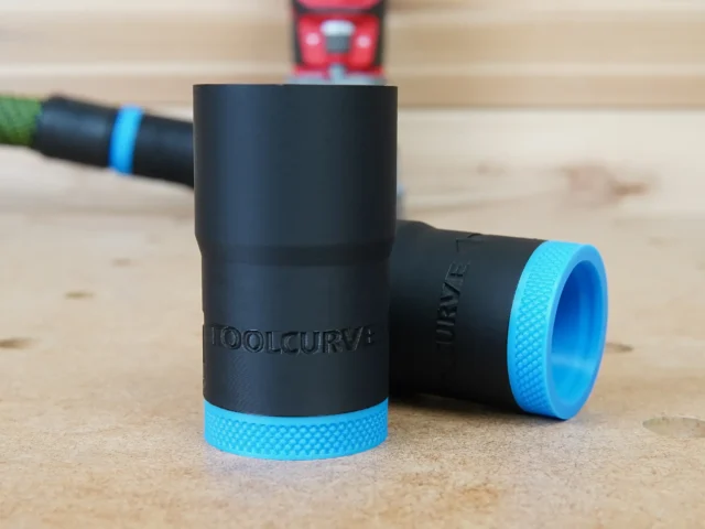 Black hose adapter with blue grip ring for Craftsman 20v router, shown with matching dust hose, product name embossed on side