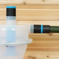 Two black ToolCurve 36mm hose adapters with blue rings on a Cen-Tec separator, one joined to a green hose